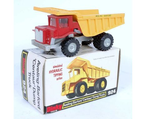 A Dinky Toys No. 924 Aveling Barford Centaur dump truck comprising of red, yellow and silver body with silver cast metal hubs