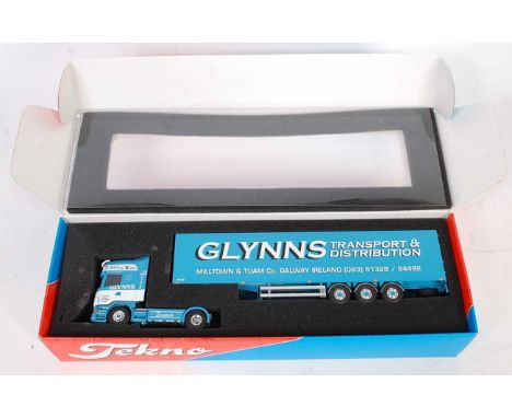A Tekno 1/50 scale Glynns Transport &amp; Distribution model of a Scania Topline R580 tractor unit with box trailer housed in
