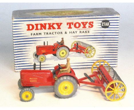 A Dinky Toys No. 27AK farm tractor and hay rake, both of usual specification, finished in red and yellow with tan driver, hou