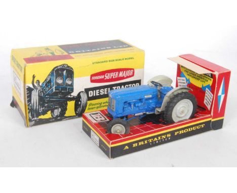 A Britains No. 9525 Fordson Super Major diesel tractor comprising of blue body with grey plastic hubs, and grey mudguards, mi