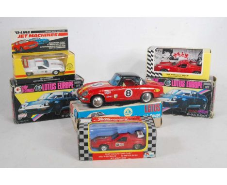 Six various boxed diecast and tinplate Lotus related vehicles to include an ATC Asahi Toy Co Ltd, tin plate model of a Lotus 