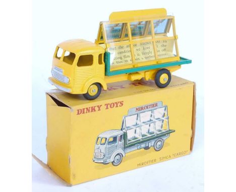 A French Dinky Toys No. 33C Glaziers van comprising of yellow cab and chassis with matching hubs and green and yellow back wi