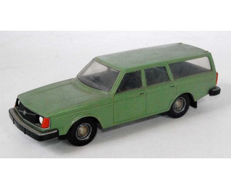 A 'Made in Finland' plastic scale model of a Volvo 245DL estate car, finished in green with black interior and silver hubs