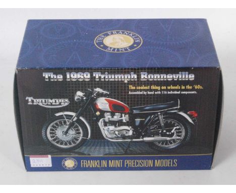 A Franklin Mint Precision models 1/10 scale model of a Triumph 1969 Bonneville housed in the original polystyrene packed box 