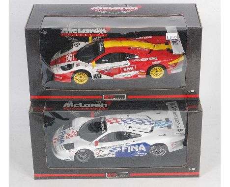 A UT Models Maclaren Collection boxed race car diecast group, both 1/18 scale to include Ref. Nos. 39710 Maclaren F1 GTR 1997