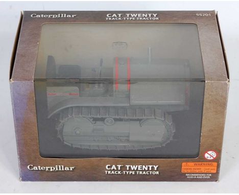 A Norscot No. 55201 1/16 scale model of a Caterpillar CAT 20 track type tractor finished in grey and red and housed in the or