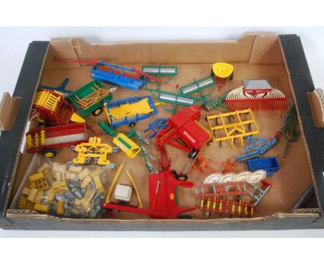 One tray containing a quantity of various loose Britains and other farm implements and attachments to include a New Holland N