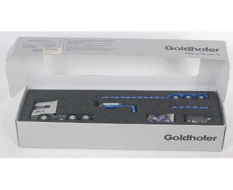 A Tekno 1/50 scale boxed model of a Goldhofer Scania R620 tractor unit with three axle low loader trailer, housed in the orig