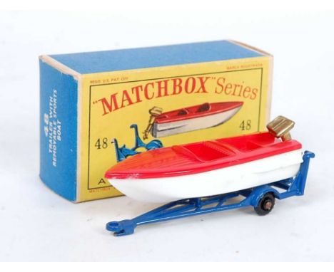 A Matchbox No. 48 trailer with removable sports boat comprising of dark blue trailer with black plastic wheels, red and white