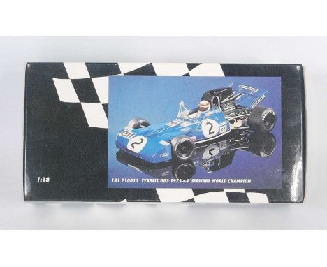 A Minichamps Model No. 710011 1/18 scale model of a 1971 Tyrrell 003 Jackie Stewart World Champion race car finished in blue 