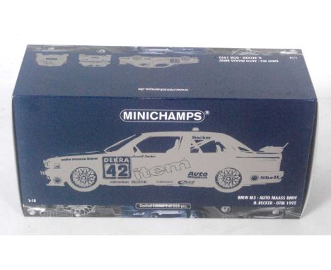 A Minichamps No. 922042 1/18 scale model of an H Becker DTM 1992 BMW M3 race car, finished in dark blue with racing No. 42, h