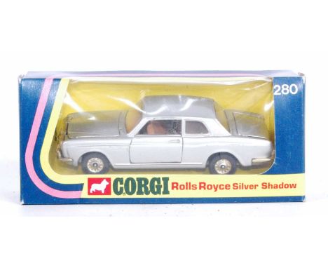 A Corgi Toys No. 280 Rolls Royce Silver Shadow comprising of silver body with brown interior, housed in the original yellow g