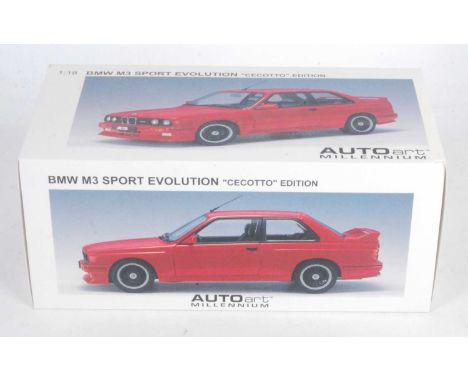 An Autoart Model No. 70566 1/18 scale model of a BMW M3 Sport Evolution Cecotto edition finished in red with black hubs and h