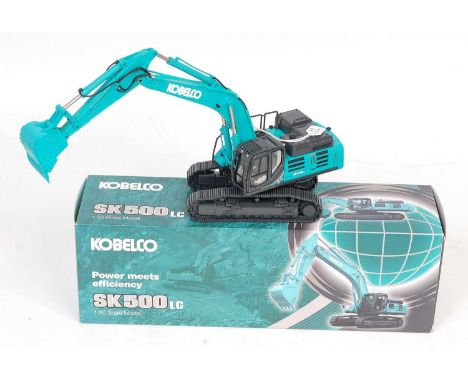 A Conrad No. 2210 1/50 scale model of a Kobelco SK500LC crawler excavator, finished in light blue and grey, and housed in the