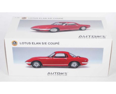 An Autoart Millennium edition Model No. 75351 1/18 scale model of a Lotus Elan Coupe S/E S3 diecast finished in red, and hous