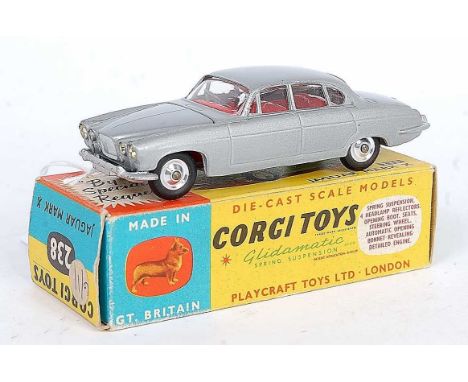 A Corgi Toys No. 238 Jaguar Mk 10 comprising silver body with red interior and spun hubs, housed in the original blue &amp; y