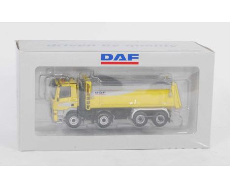 A WSI Collectables Model No. M002855 1/50 scale model of a DAF CF85 Daycab 4-axle tipper, finished in yellow and black with D