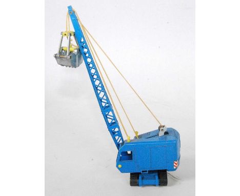 A Siku No. V325 1/56 scale Menck gripping excavator with bucket, loose example, finished in blue &amp; yellow (VG)