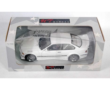 A UT Models No. 20482 1/18 scale model of A BMW M3 GTR street car finished in white, housed in the original window box, box w