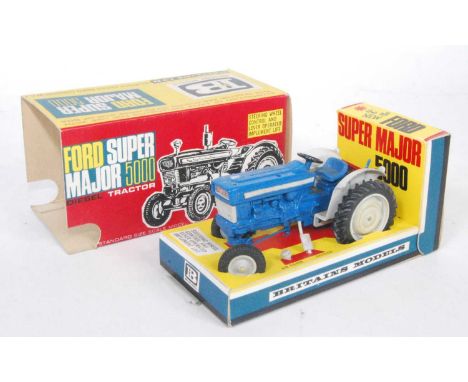 A Britains No. 9527 Ford Supermajor 5000 tractor, comprising blue body with grey fixtures and fittings, together with grey pl