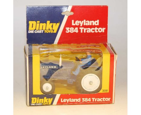 A Dinky Toys No. 308 Leyland 30F tractor comprising dark blue body with driver figure and white metal/plastic hubs, housed in