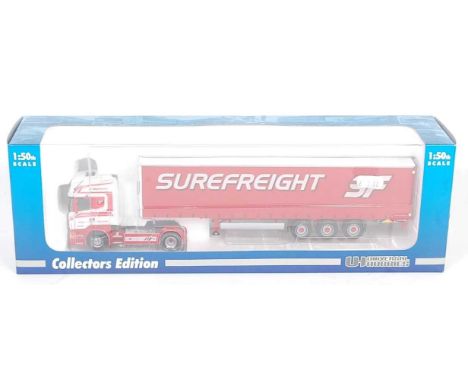 A Universal Hobbies 1/50 scale boxed model of a Surefreight Scania R500 V8 Topline, together with a curtainside trailer, limi