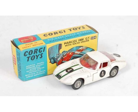 A Corgi Toys No. 324 Marcos 1800 GT comprising of red body with red interior and racing No. 4 with wirework hubs, housed in t