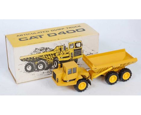 A Conrad Model No. 2862 1/50 scale model of a Caterpillar D400 articulated dump truck, comprising of Caterpillar yellow body 