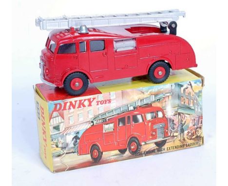 A Dinky Toys No. 955 fire engine comprising of red body with silver ladder, grey hose reels and red plastic hubs, housed in t