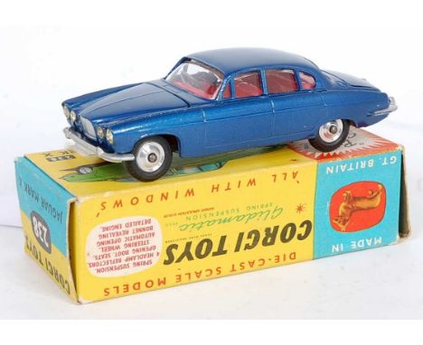 A Corgi Toys No. 238 Jaguar Mk 10 comprising of metallic dark blue body with red interior and spun hubs, housed in the origin