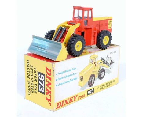 A Dinky Toys No. 973 Eaton Yale articulated tractor shovel comprising of orange and yellow body, with yellow plastic hubs and