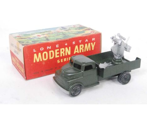 A Lonestar Modern Army Series boxed model of a rocket launching lorry comprising green body with black hubs and silver rocket