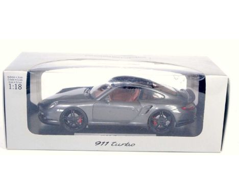 A Norev boxed Porsche design driver's selection, boxed model of a Porsche 911 turbo finished in metallic graphite grey with b