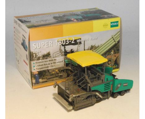 An NZG Model No. 744 1/50 scale model of a Vogele Super 18 03-2 wheeled paver, housed in the original polystyrene packed Voge