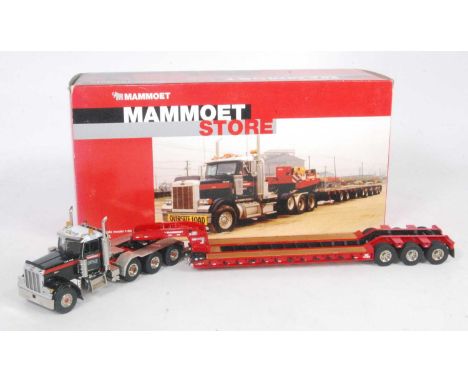 A TWH Collectables Model No. DHS0100 model of a Mammoet Store Peterbilt tractor unit with low loader trailer housed in the or