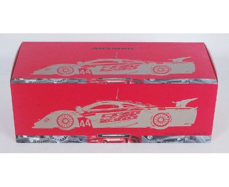 A Minichamps model No. 530 13374 1/18 scale model of a Maclaren F1 GTR 1997 24 hour Le Mans race car, finished with Lark Team