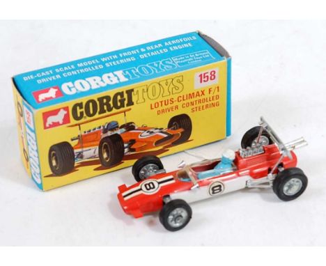 A Corgi Toys No. 158 Lotus Climax F1 racing car comprising of orange and white body with racing No. 8 and blue driver figure,