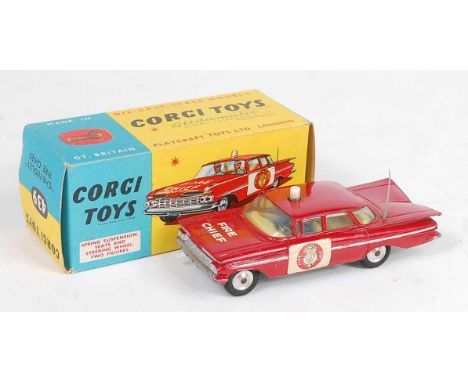 A Corgi Toys No. 439 Chevrolet Fire Chief comprising of  red body with lemon interior and two figures and spun hubs housed in