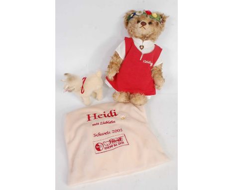 A Steiff Heidi teddy bear, white tag to ear numbered 660788, brown/blond mohair, wearing felt dress with red pinafore, also w