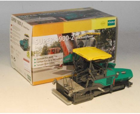 An NZG No. 671 1/50 scale model of a Vogele Wirtgen Super 1900-2 tracked paver, housed in the original polystyrene packed box