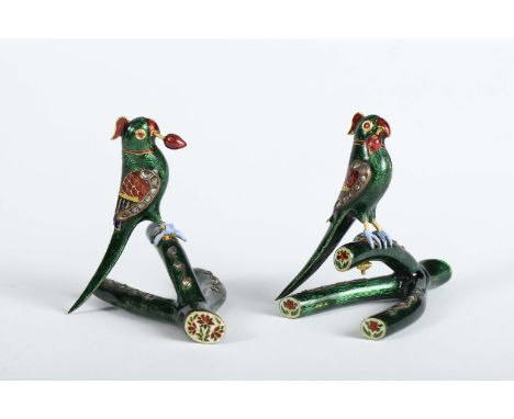 Parrots, a pair of enamelled gold sculptures, eyes set with cabochon cut rubies, wings and trunks set with rose cut diamonds,
