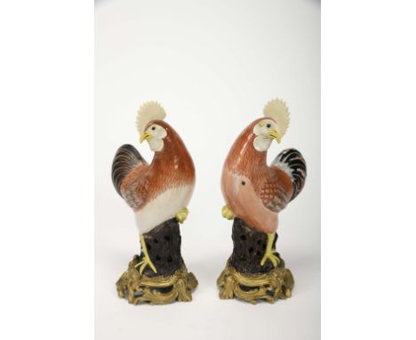 Roosters, a pair of Chinese export porcelain sculptures, polychrome and gilt decoration with unglazed heads and crests, Qianl