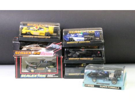 Seven boxed / cased Scalextric slot cars to include C289 Porsche With Lights - Gold, C125 Porsche (split to box window), C126