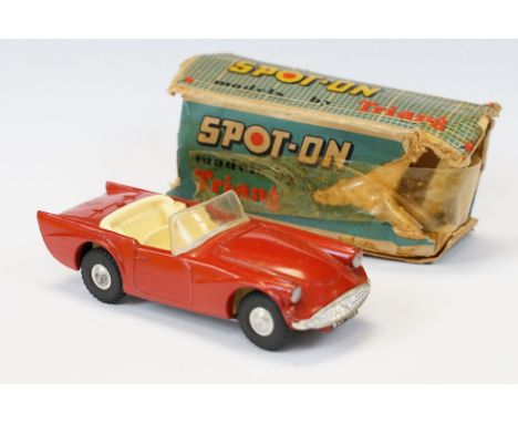 Triang Spot On Daimler SP250 diecast model in red with pale yellow interior, diecast in a good play worn condition with gd wi