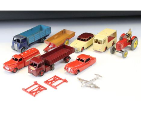 Eight mid 20th C play worn diecast models to include NGB Electric Van, ESSO Tanker, Massey Harris Tractor etc 