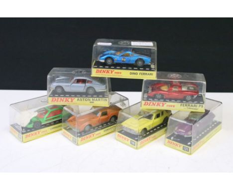 Seven cased Dinky diecast models to include 131 Jaguar E Type 2+2, 188 Jensen FF, 221 Corvette Stingray, 153 Aston Martin DB6