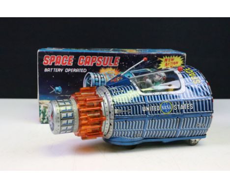 Boxed S.H. Horikawa Japanese Space Capsule battery operated tinplate model, circa 1960s, with seated tinplate astronaut pilot