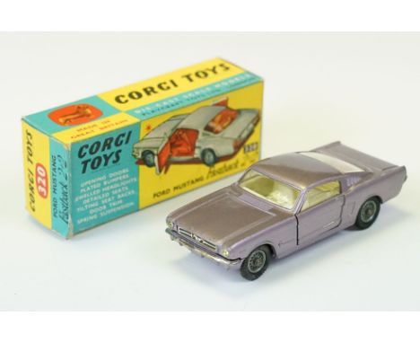 Boxed Corgi 320 Ford Mustang Fastback 2+2 diecast model in metallic lilac with white interior, diecast ex with minimal wear, 