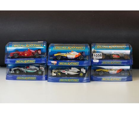 Six cased Scalextric F1 slot cars to include C3263 Mercedes GP Petronas 2012 Schumacher No 7, C3364 Lotus F1 Team 2013 Kimi R