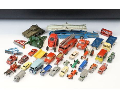 Over 30 mid 20th C play worn diecast models to include Dinky, Matchbox, Solido and Britains to include Corgi Austin Seven, Di